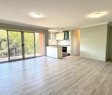 OVERSIZED 2 BEDROOM APARTMENT WITH LOCK UP GARAGE - Photo 2