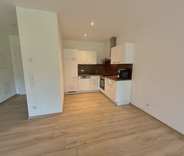 Ideale 2-Zimmer Gartenwohnung mit Tiefgarage und Parkplatz - Foto 2