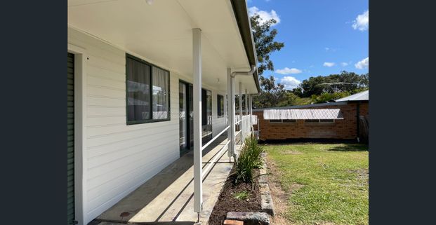 EASY CARE HOME IN A CONVENIENT LOCATION - Photo 1