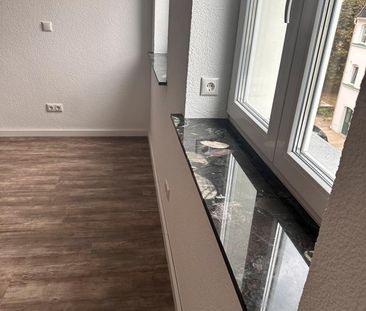 Helle Zweiraumwohnung mit Einbauküche in zentraler Lage - Photo 1
