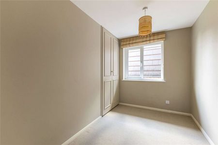 A bright and centrally located, two bedroom second floor apartment with off street parking - Photo 2