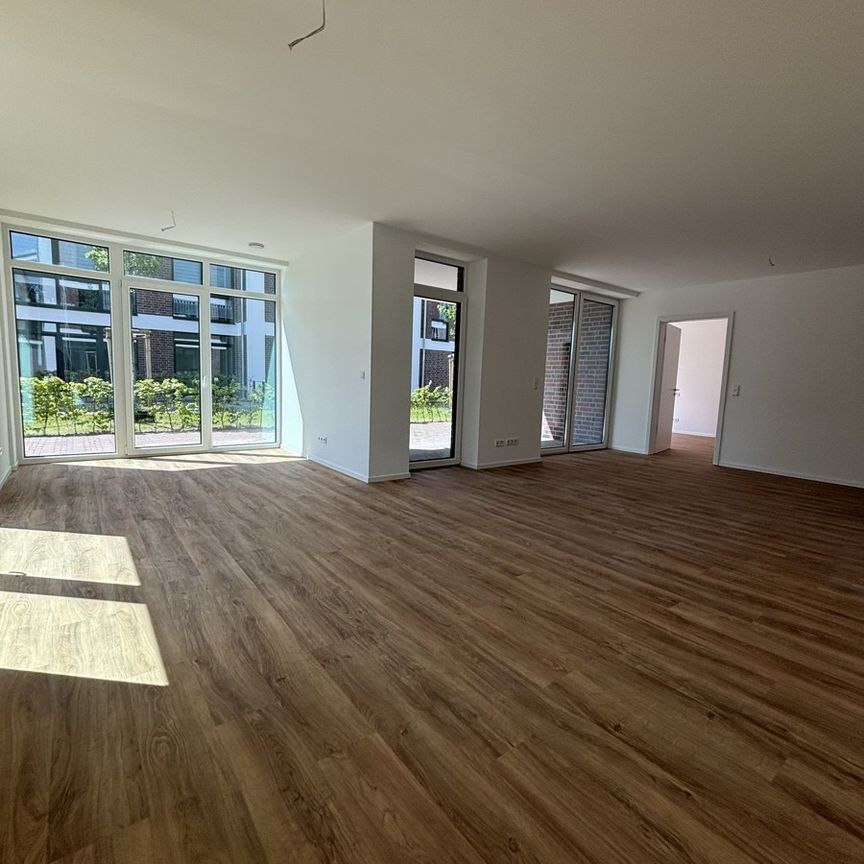 Sonnige Erdgeschosswohnung am Norder Tor mit großer Terrasse zur Miete! - Photo 1