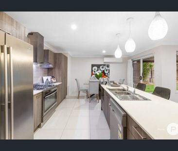 Stylish Family Living with Multiple Living Zones & Beautiful Outdoo... - Photo 3