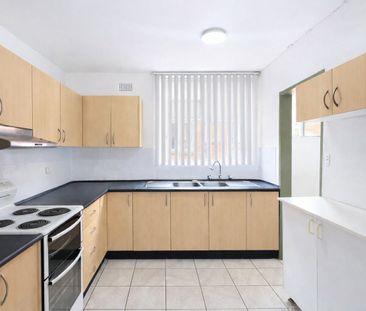 WELL-PRESENTED 2-BEDROOM UNIT IN A GOOD CABRAMATTA LOCATION - Photo 3
