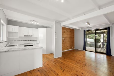 Spacious 3- Bedroom Family Home with Solar, Triple Garage & Waterfront Location - Photo 2