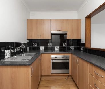 Two-Bedroom Gem with Secure Parking in a Winning Location! - Photo 4