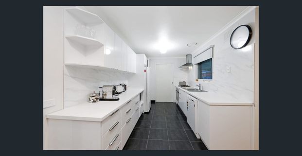 Neat 3 Bedroom Home with Spacious Living and Backyard - Photo 1