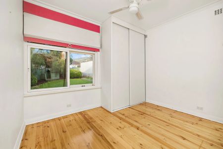 UNFURNISHED - Charming Solid-brick Home with Treetop Views - Photo 5