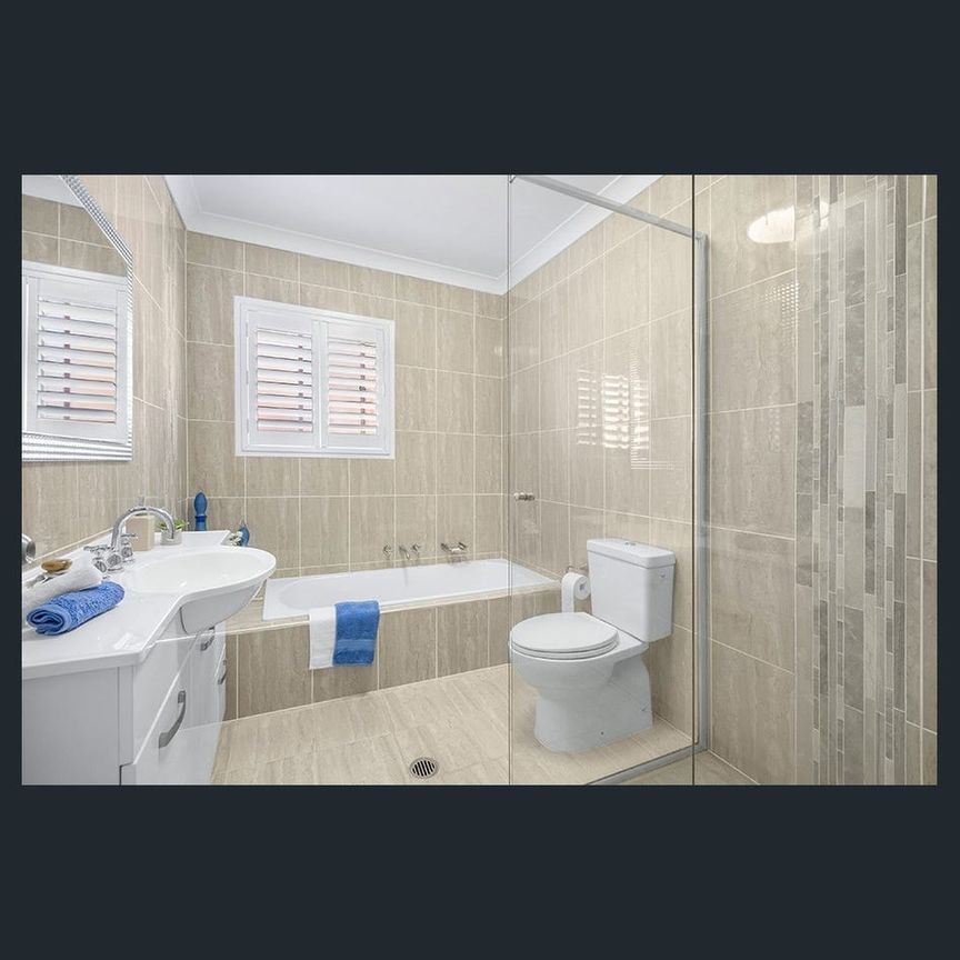 Spacious and stylish, this three-bedroom home offers modern comfort and an unbeatable location just minutes from the coast. - Photo 1