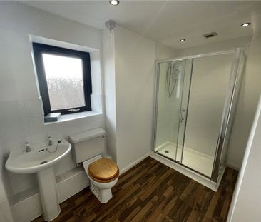 A three bedroom mid-terrace two storey barn conversion with a garage. - Photo 4