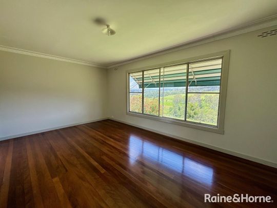 ELEVATED FARMHOUSE WITH SHED - Photo 1
