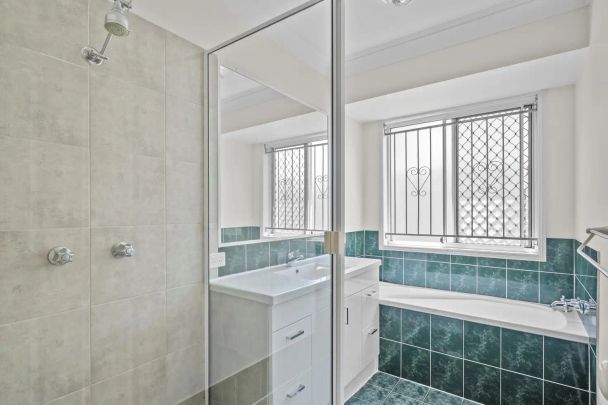 “Fresh, Spacious and Family Friendly Living in a Super Convenient Location” - Photo 1