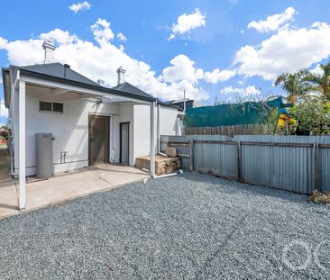 Open the Door to Coastal Charm with Modern Comfort - Photo 2