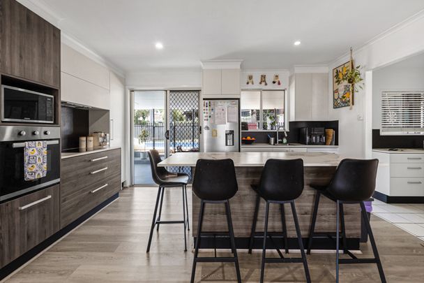 Brick home with huge entertainment area and pool - Photo 1