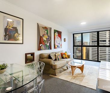 TASTEFULLY FURNISHED ONE BEDROOM APARTMENT IN THE ASTON | Furnished - Photo 1