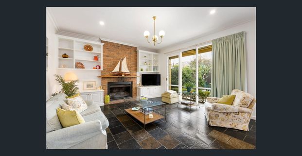 CHARMING VICTORIAN-INSPIRED HOME IN A BRIGHT, LOW MAINTENANCE GARDEN SETTING! - Photo 1