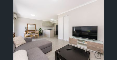 Furnished or Unfurnished Fantastic Townhouse in a Central Location! - Photo 2