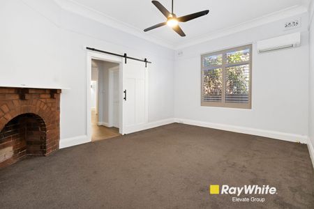 Spacious and Stylish Family Home with Sunroom and Large Backyard - Photo 2