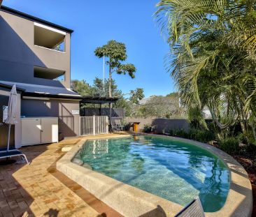 Beat the heat by the pool this summer in this 2 bedroom quiet complex - Photo 1