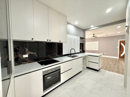 Fully Renovated Three-Bedroom Home with Carport Parking - Photo 2