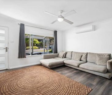 Family home with multiple living zones and large fenced yard - Photo 3