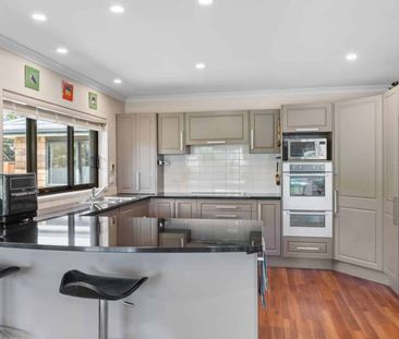 Spacious Four-Bedroom Home with Multiple Living Areas and Private G... - Photo 2