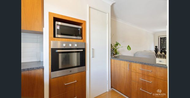 Spacious 1-Bedroom Apartment with Tranquil Lake Outlook - Photo 1