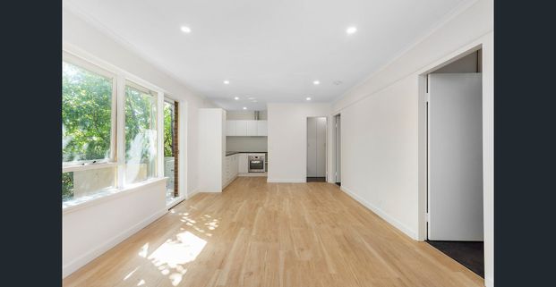 SUNLIT SANCTUARY IN THE HEART OF SANDY VILLAGE - Photo 1