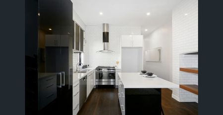 Bright & Renovated Edwardian with Off-Street Parking - Photo 4