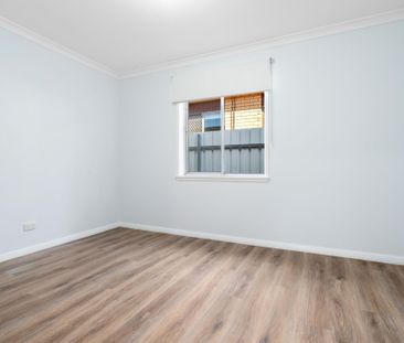 RENOVATED TWO BEDROOM UNIT WITH MODERN COMFORTS - Photo 1