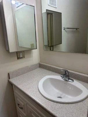 Surrey Manor - 11003 29A Avenue Northwest — 3 Bedroom - Photo 1