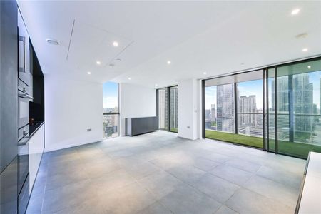 This outstanding three-bedroom apartment is set within the prestigious Dollar Bay development, perfectly positioned on the edge of South Quay Dock in Canary Wharf. - Photo 4