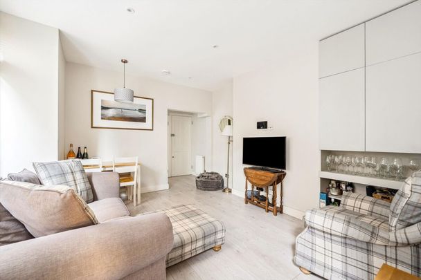 Presenting a stylish 2 bedroom flat offering an attractive opportunity for those seeking a balanced lifestyle in one of London's most dynamic neighbourhoods - Photo 1