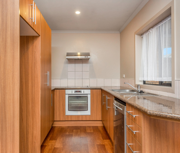 This tidy, two bedroom townhouse is situated within walking distanc... - Photo 3