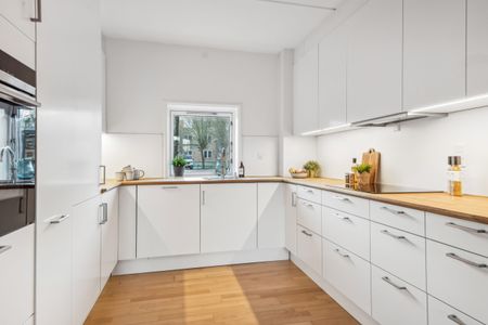 Flot lejlighed i populær ejendom - Photo 3