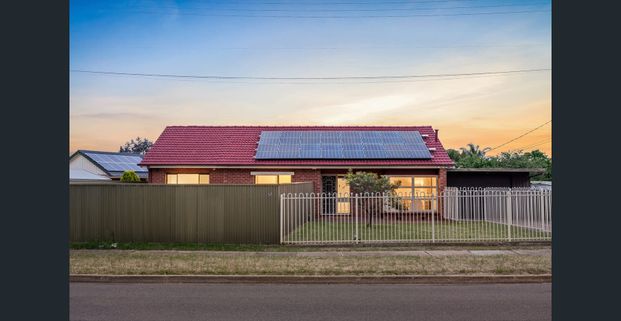 Charming Family Home with Spacious Living & Pool - Photo 1