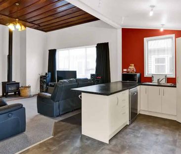 Tidy 3-Bedroom Home with Large Covered Deck - Photo 1