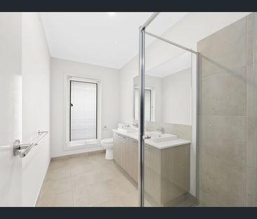 FOUR BEDROOM HOME WITH TWO LIVING AREAS AND DUCTED HEATING AND COOLING - Photo 4