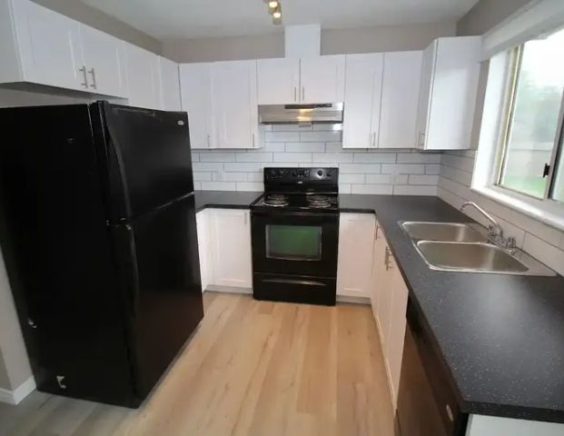 Great Just Renovated 4 Bedroom with 2 Full Bathrooms and Fenced in Yard | Calgary - Photo 1