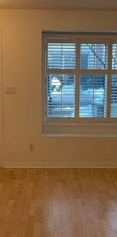 Trendy 1-BR stacked condo townhouse for rent at the King West Village - Photo 1