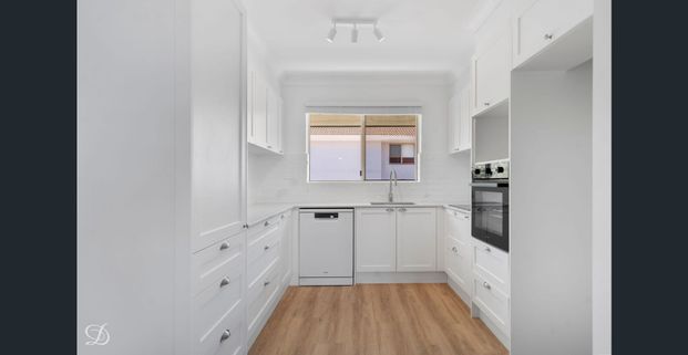 Top Floor Unit with City Views and Two-Car Accommodation - Photo 1