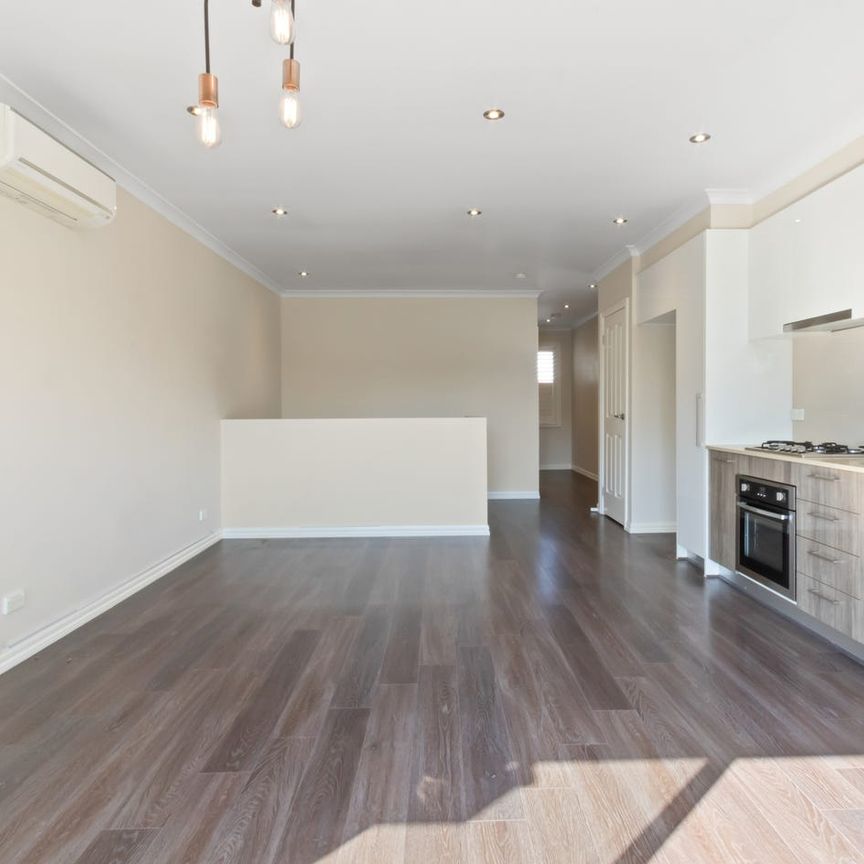 Stylish Two-Bedroom Townhouse in a Convenient Reservoir Location - Photo 1