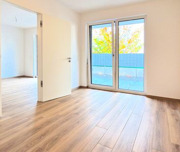 Moderne EG-Wohnung mit Terrasse, hochwertiger Ausstattung und großen Keller in zentraler Lage - Foto 1