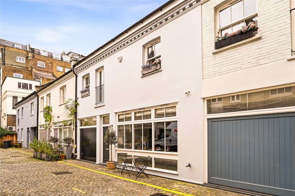 A newly refurbished mews house with contemporary fixtures, fittings and furnishings on a quiet residential street in South Kensington. - Photo 1