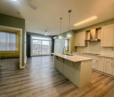 Sunlit 2 Bed + 2 Bath Condo With A/C In Walden | Underground Parking - Photo 4