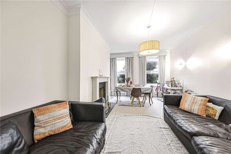 A contemporary three bedroom lateral apartment to rent in a desirable mansion block in Maida Vale. The property boasts a private balcony and communal gardens. - Photo 2