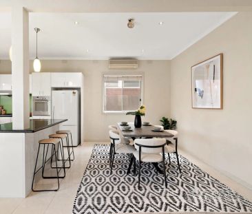 Generous Four-Bedroom Home with Backyard & Garage - Photo 1