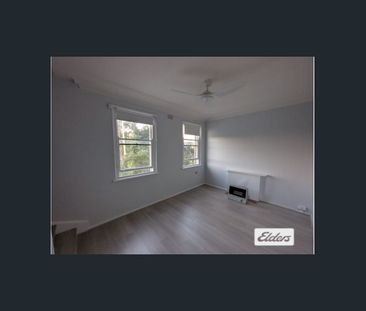 Spacious 2-Bedroom Duplex in Convenient Location - Photo 1