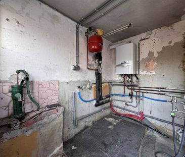 Prima gelegen ruime driegevel woning met garage en tuintje. - Photo 1