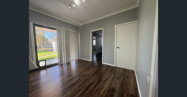 Comfortable Family Home in a Convenient Location - Photo 1